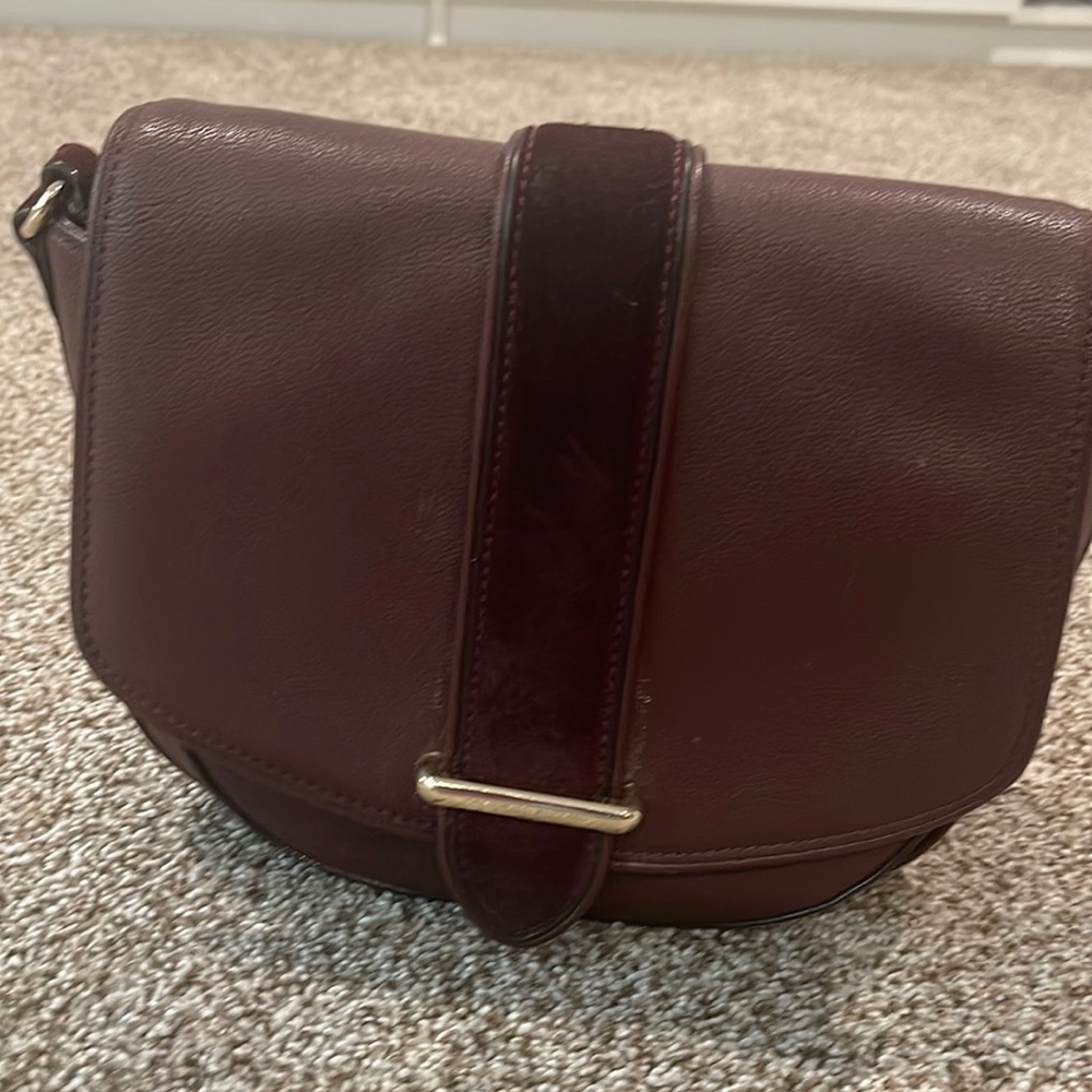 Maroon color kate spade bag with velvet and gold detail